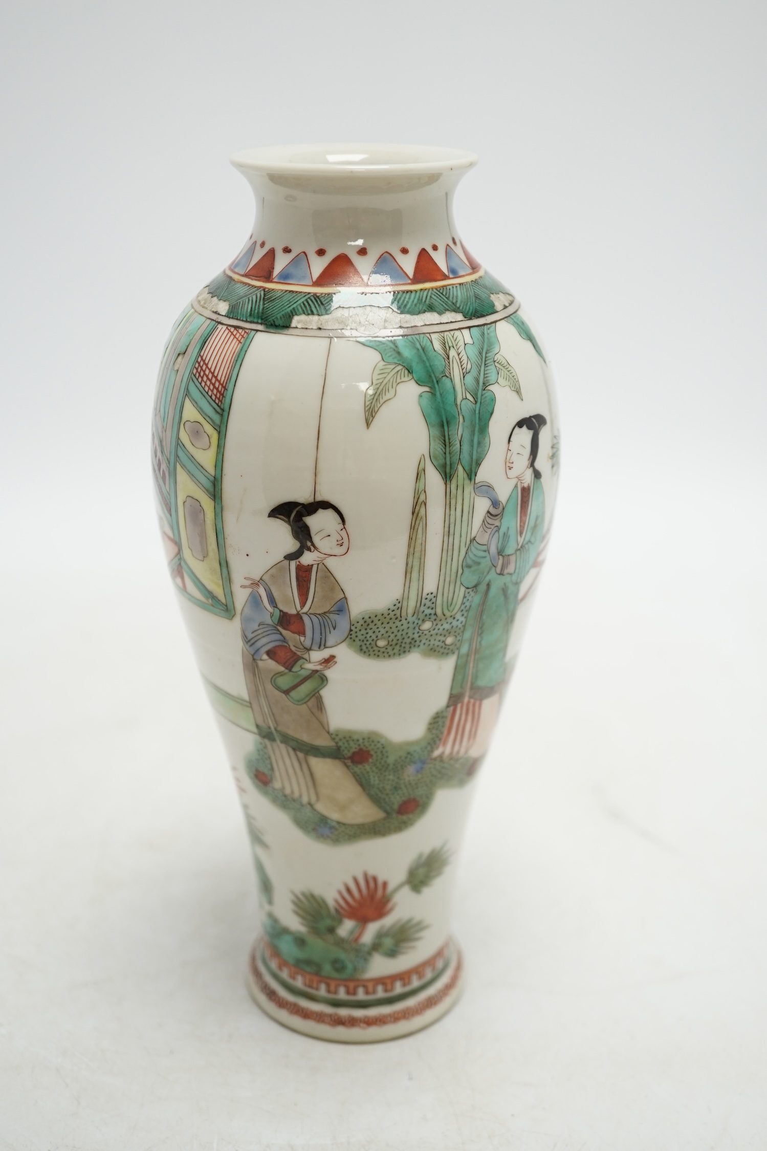 A 19th century Chinese porcelain famille verte vase and associated hardwood stand, 23cm high. Condition - good